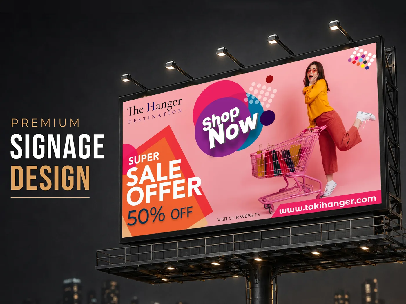 The Hanger billboard with a super sale offer lit by floodlights at night